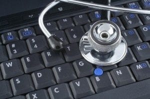 Computer with stethoscope on it