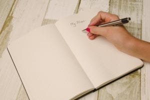 Woman writing in a notebook