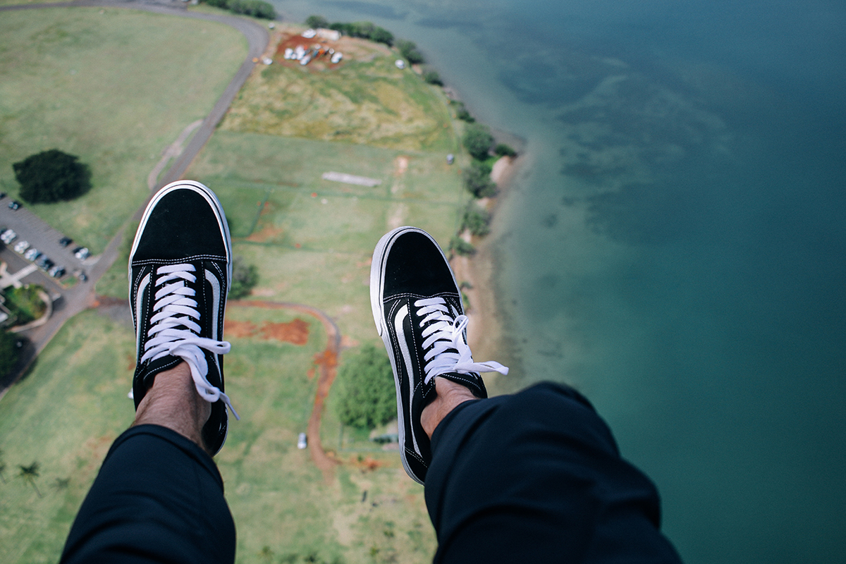 Guys sky diving wearing Vans shoes