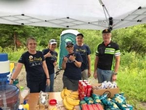 Prouty volunteers under a tent