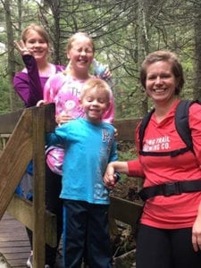 Bree hiking with her three children