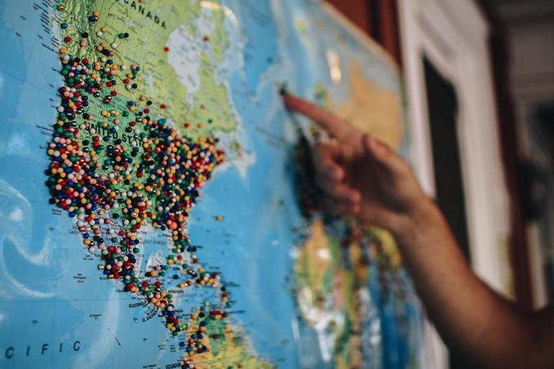 World Map on wall with pins