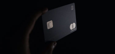 hand holding black credit card