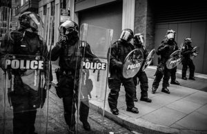 Police in riot gear lined up