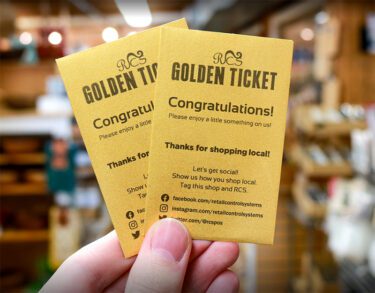 Golden Tickets held up at a kitchen store.