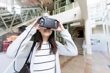 Woman trying VR technology inside a museum