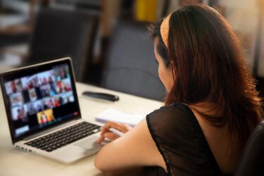 Back view of a woman on a Zoom call