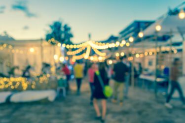 Blurry image of night festival on street blurred background with bokeh.