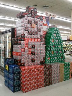 Boxes of soda cans made to look like a snowman and a tree.