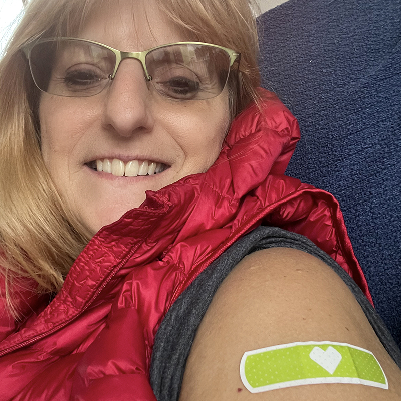 Yvette with a band-aid on her arm after getting her flu shot.
