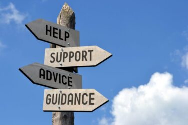 sign with the words "help" "support" "advice" and "guidance"