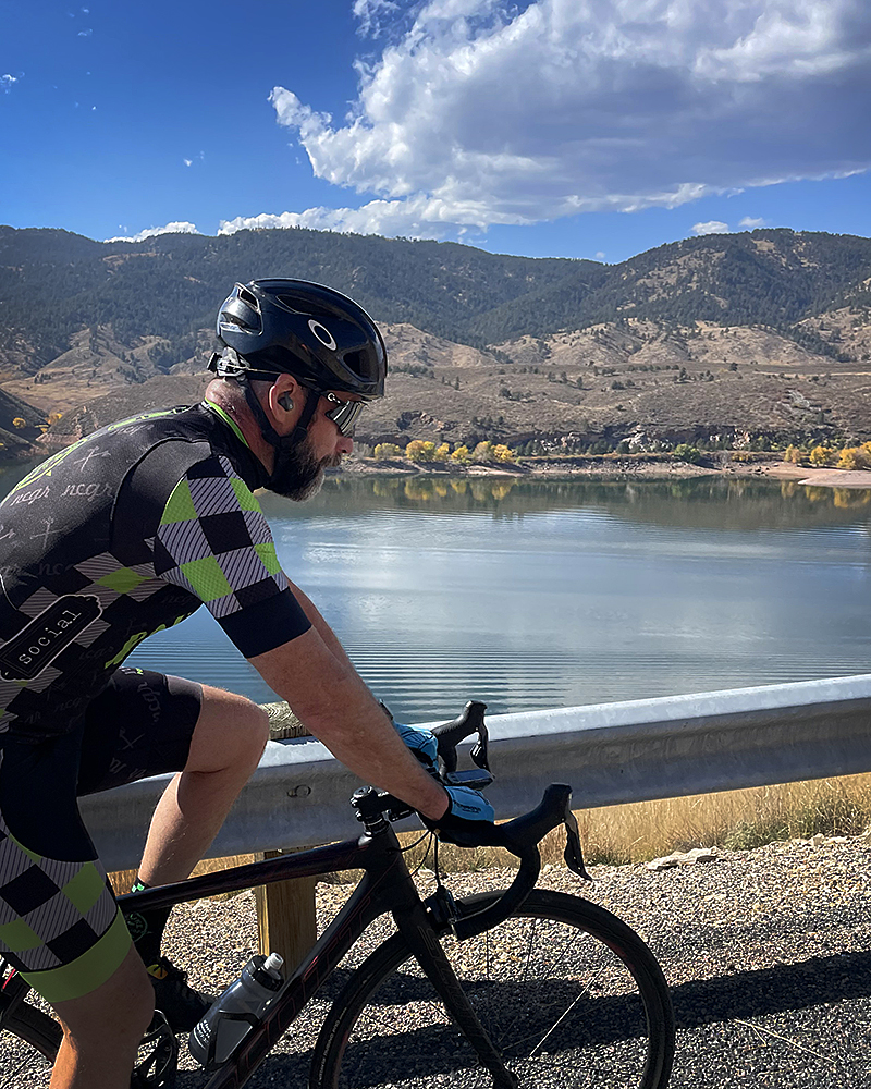 Richard riding a road bike in Colorado.