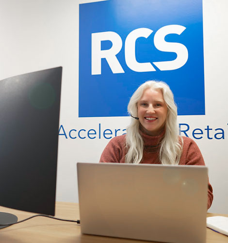 RCS Employee behind a computer