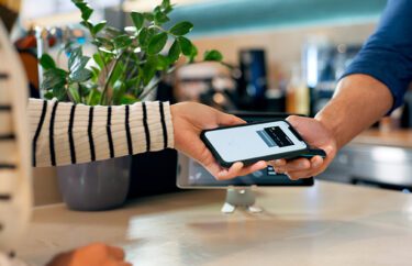 Person making a mobile transaction on their smartphone. 