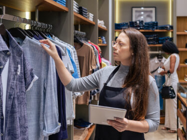 Retail sales staff reviewing inventory as part of retail operations managment tasks.